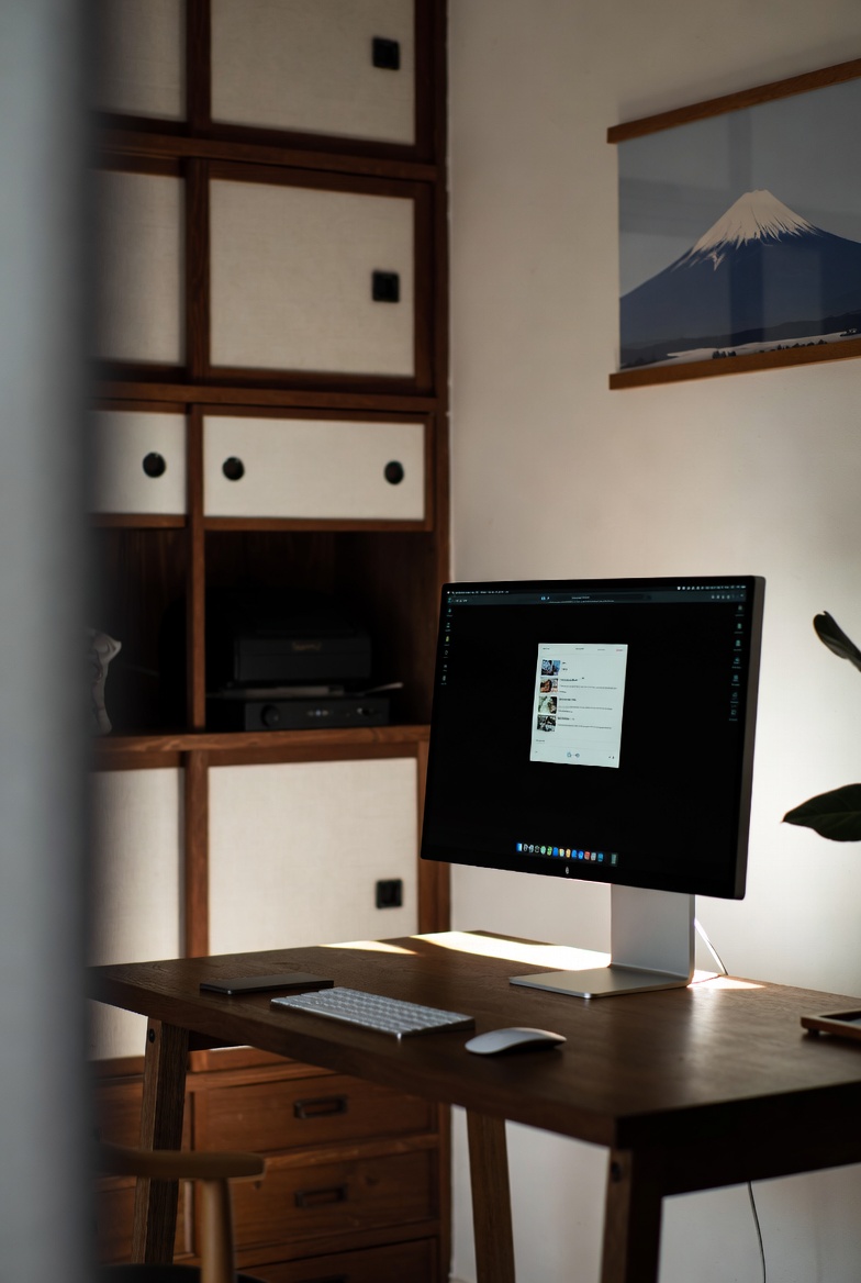 Open notebook on a wooden table with calm handwritten notes about website updates